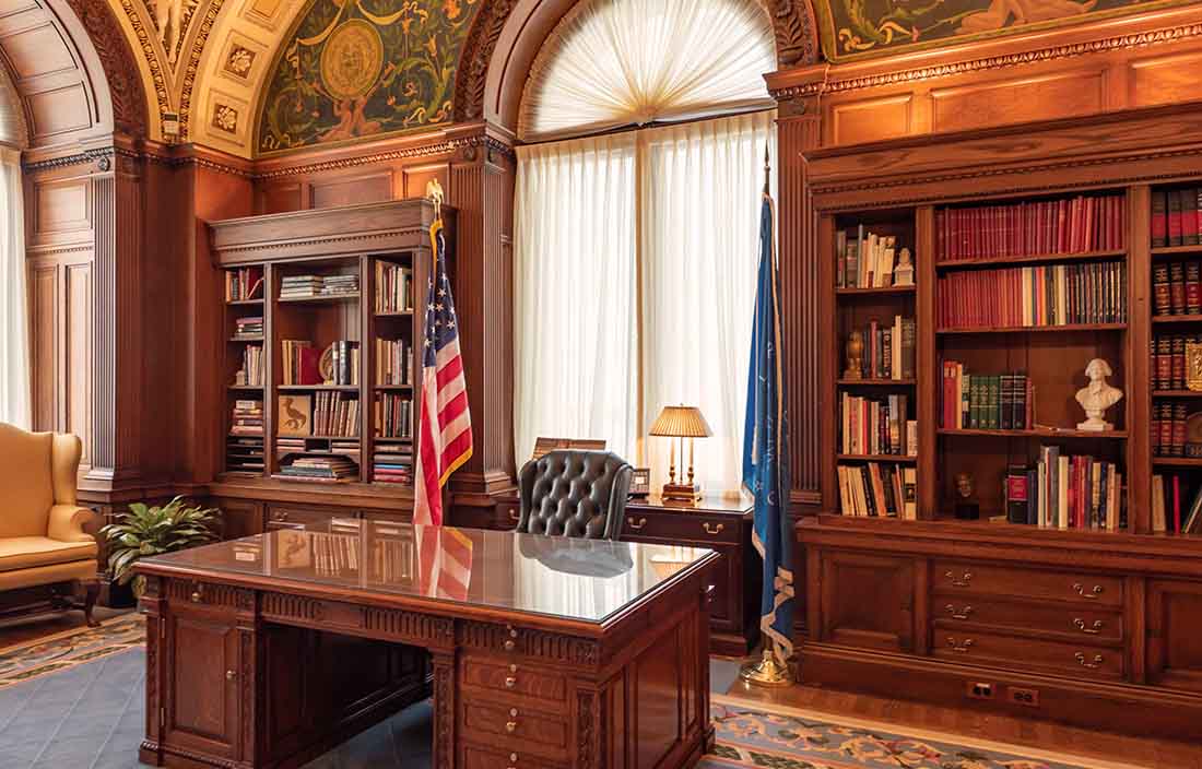 View of a government office with wooden furniture.