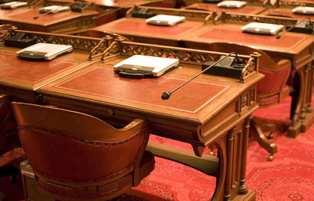 Close-up view of microphones and a desk.