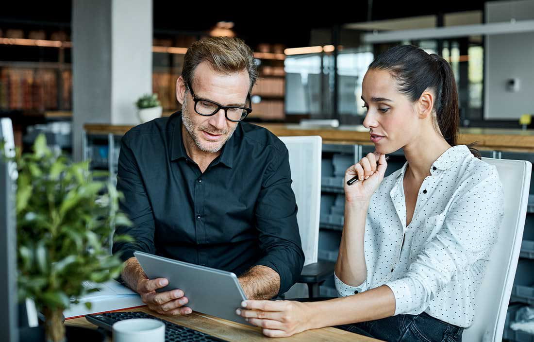 Business professional using a tablet device.