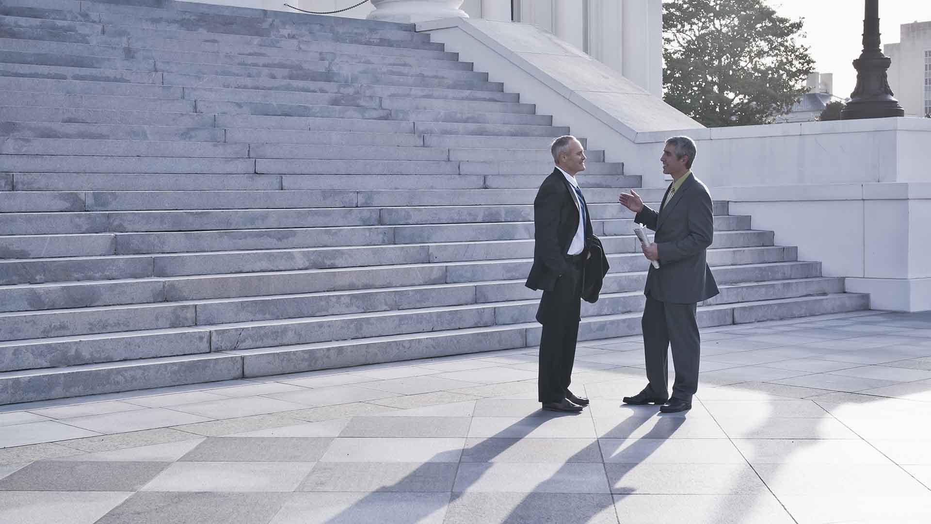 Professionals standing in front of steps