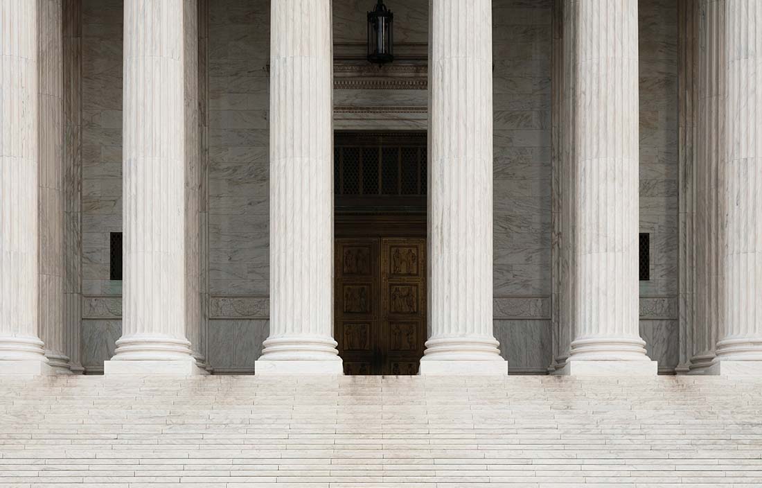 View of a government building with columns.