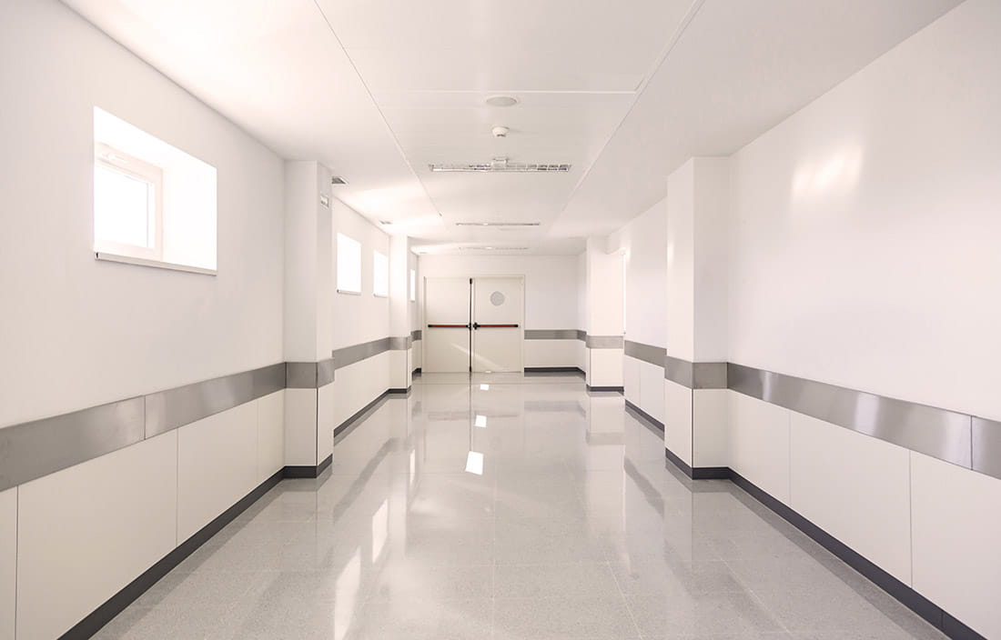 View of a hospital hallway that is empty.