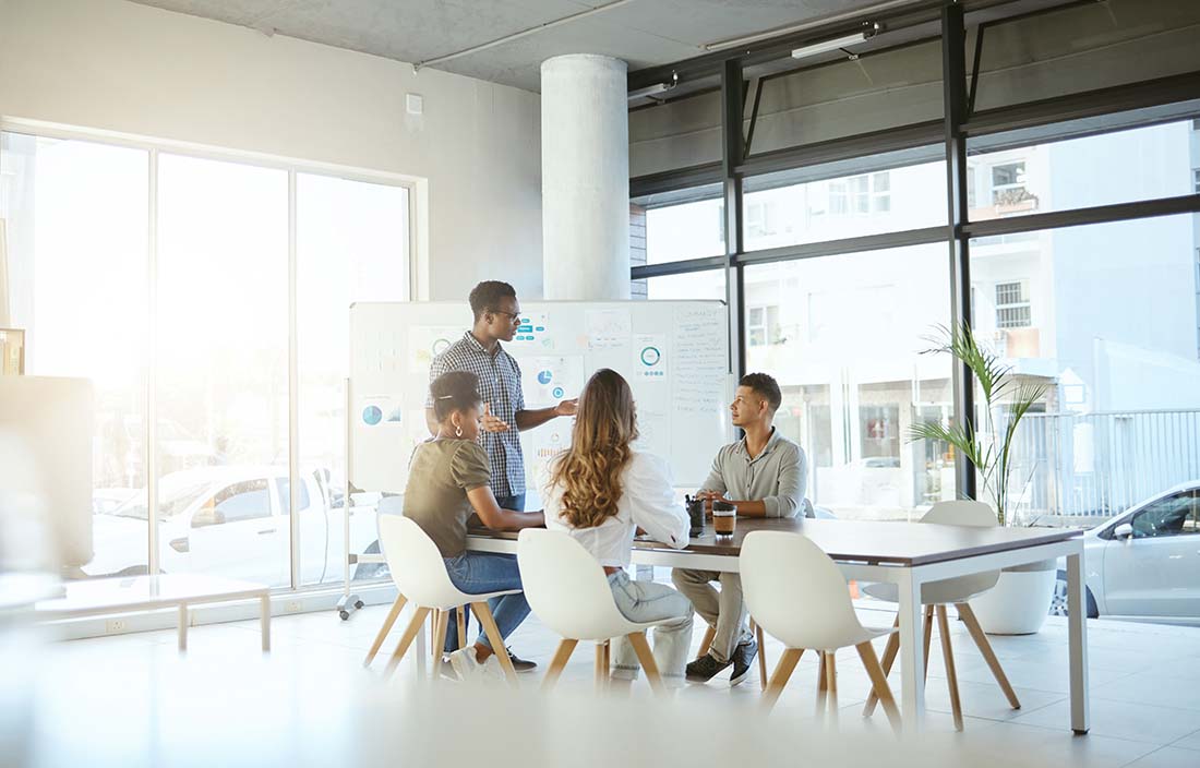 Business professionals in a modern conference room discussing international tax updates for Q3 2023