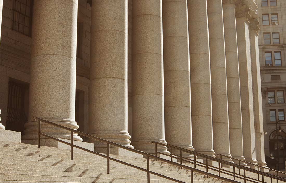 Close-up of a government building concrete steps and concrete columns
