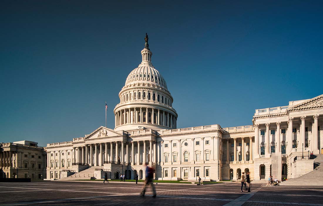 View of U.S. government building against a blue sky.