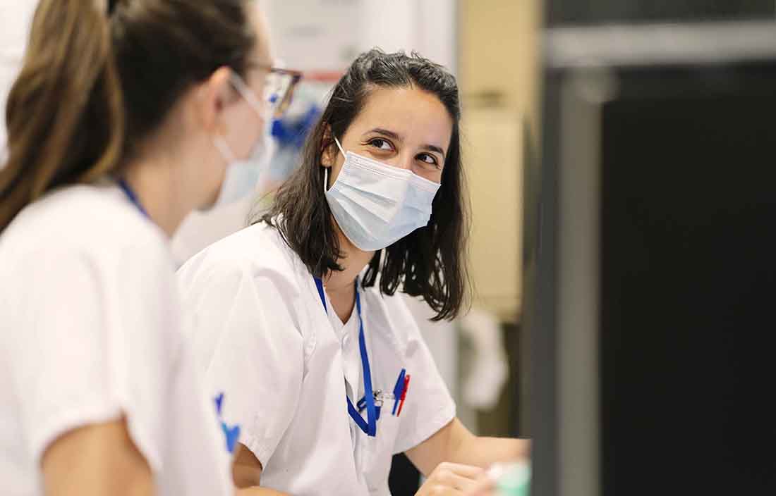 Healthcare staff in hospital working together happily.