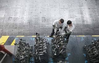 Automotive workers in a factory.