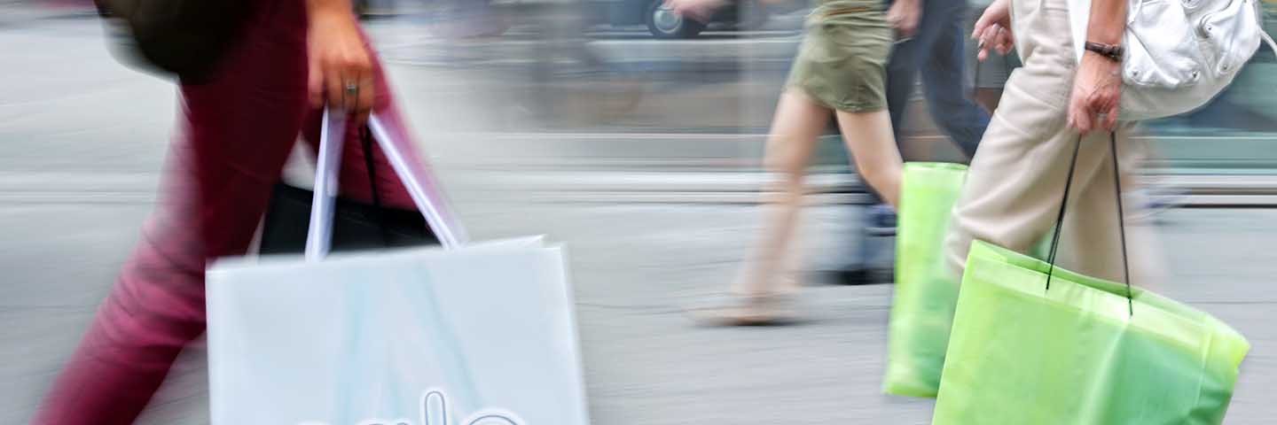 Shoppers rushing by.