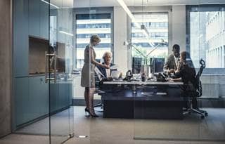 Benefits advisors gathered in a modern conference room.