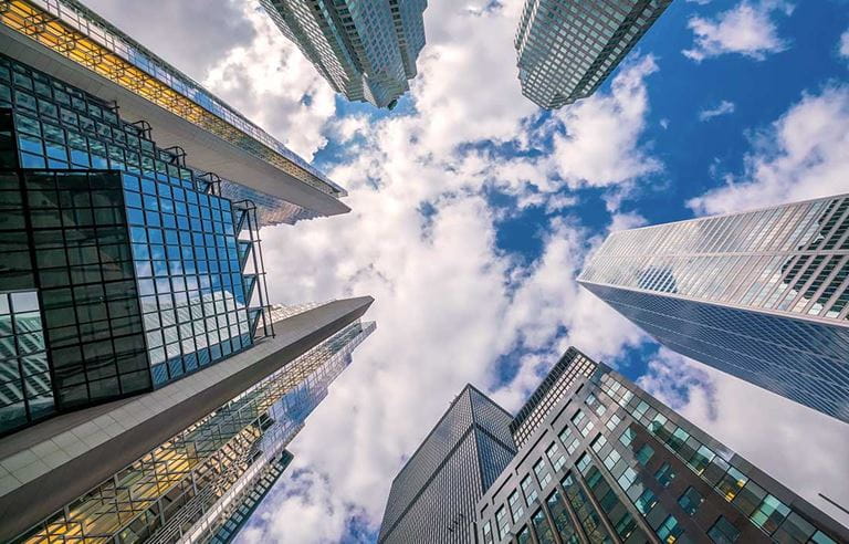 Looking up shot of downtown financial district with skyscraper office buildings