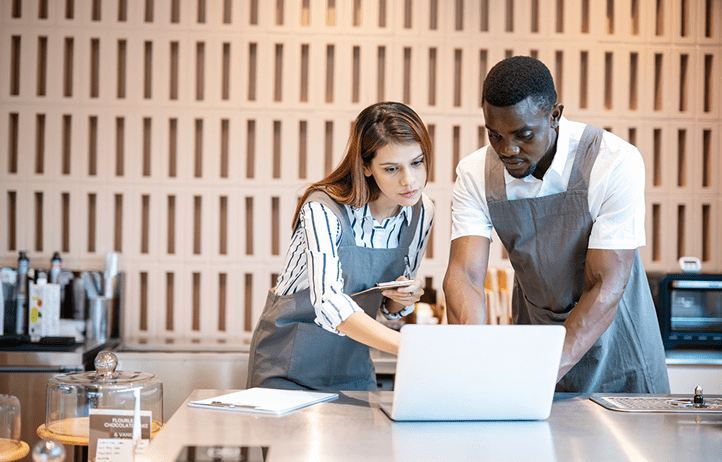Business owners checking a laptop together