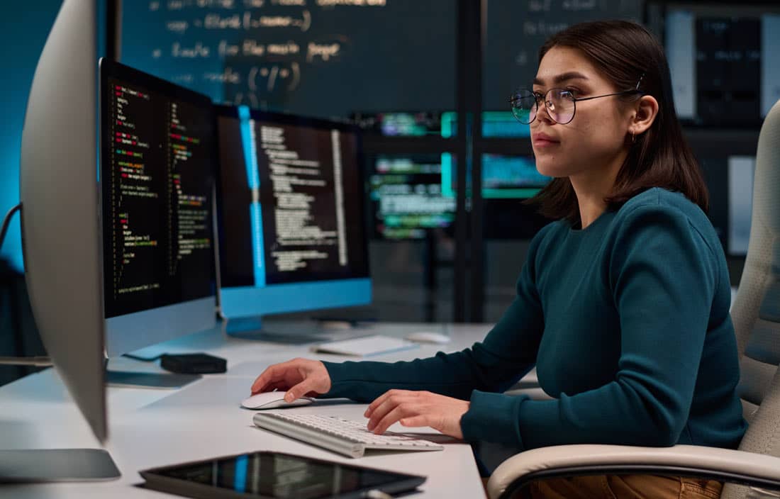 Cybersecurity professional working on their computer.