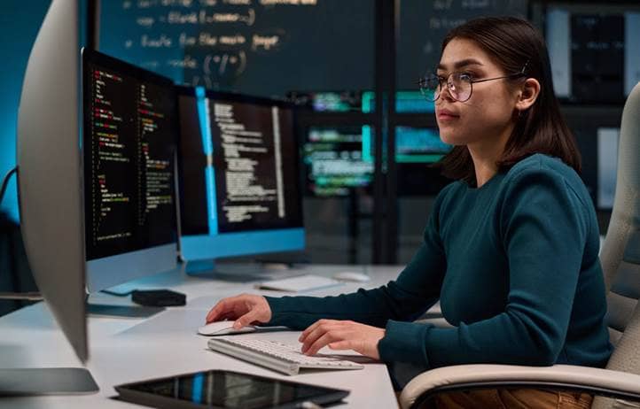 Cybersecurity professional working on their computer.