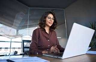 Business professional learning about digital transformation on their laptop.