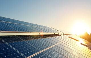 Sun shining off solar panels.