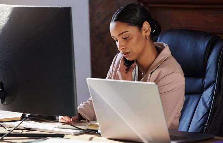 Business professional on their laptop at work.