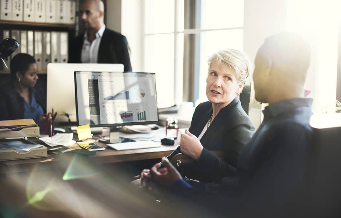 Business professionals discussing worker classification.