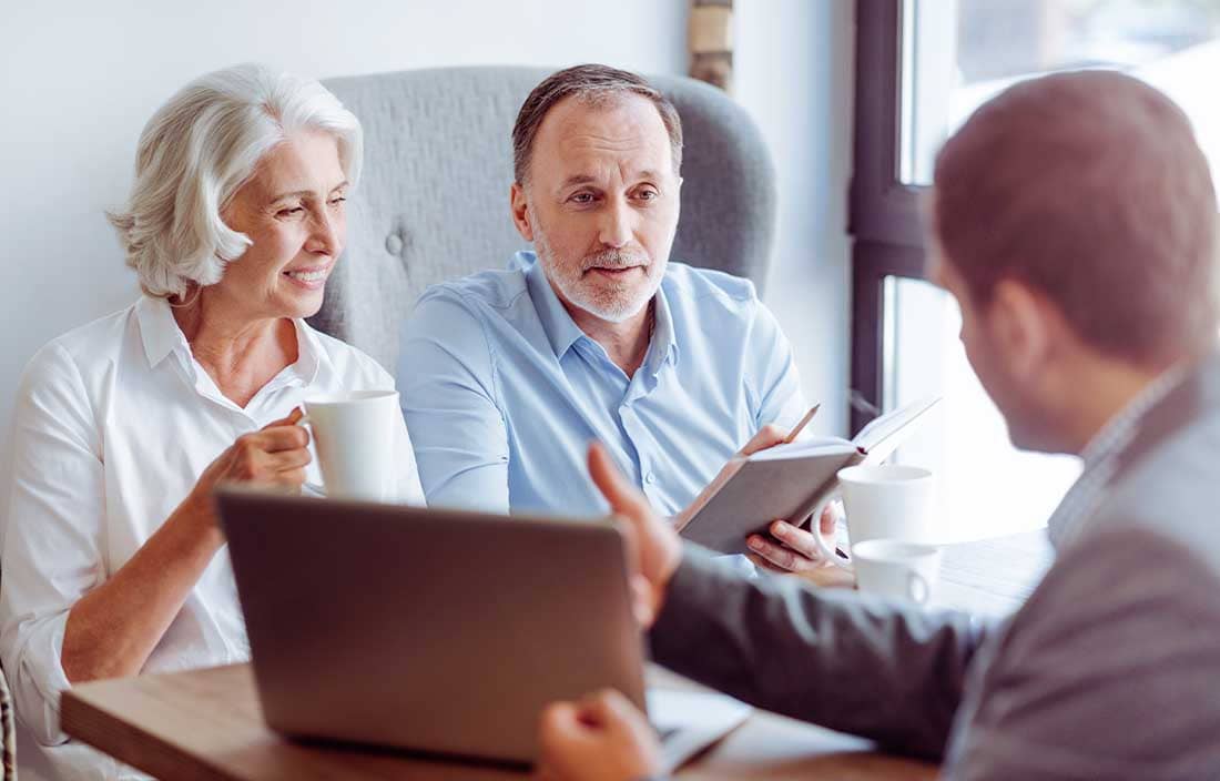 Financial advisor talking to their clients.