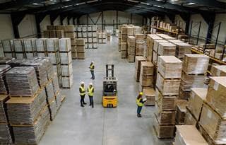 Top view of warehouse workers in warehouse.