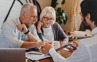 Older couple exploring the complexities of charitable estate planning.