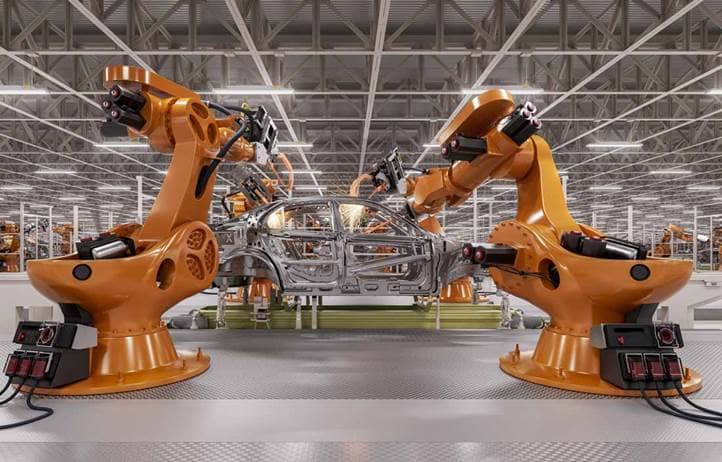 Two machines manufacturing an automobile in a factory.