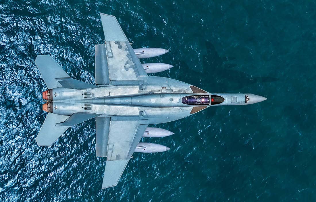 Airplane flying over water.