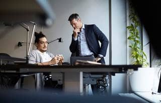 Private equity professionals discussing value creation.