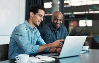 Two public sector professionals discussing ERP assessments.