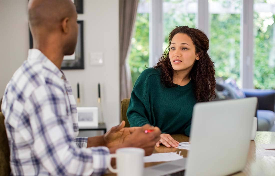 Individuals discussing how to draft a trust.
