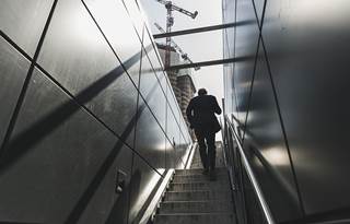 Person walking up stairs.