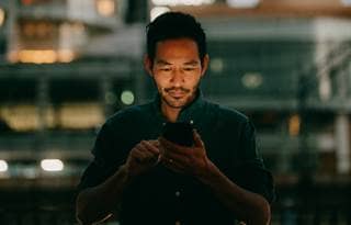 Business professional using their smart phone.