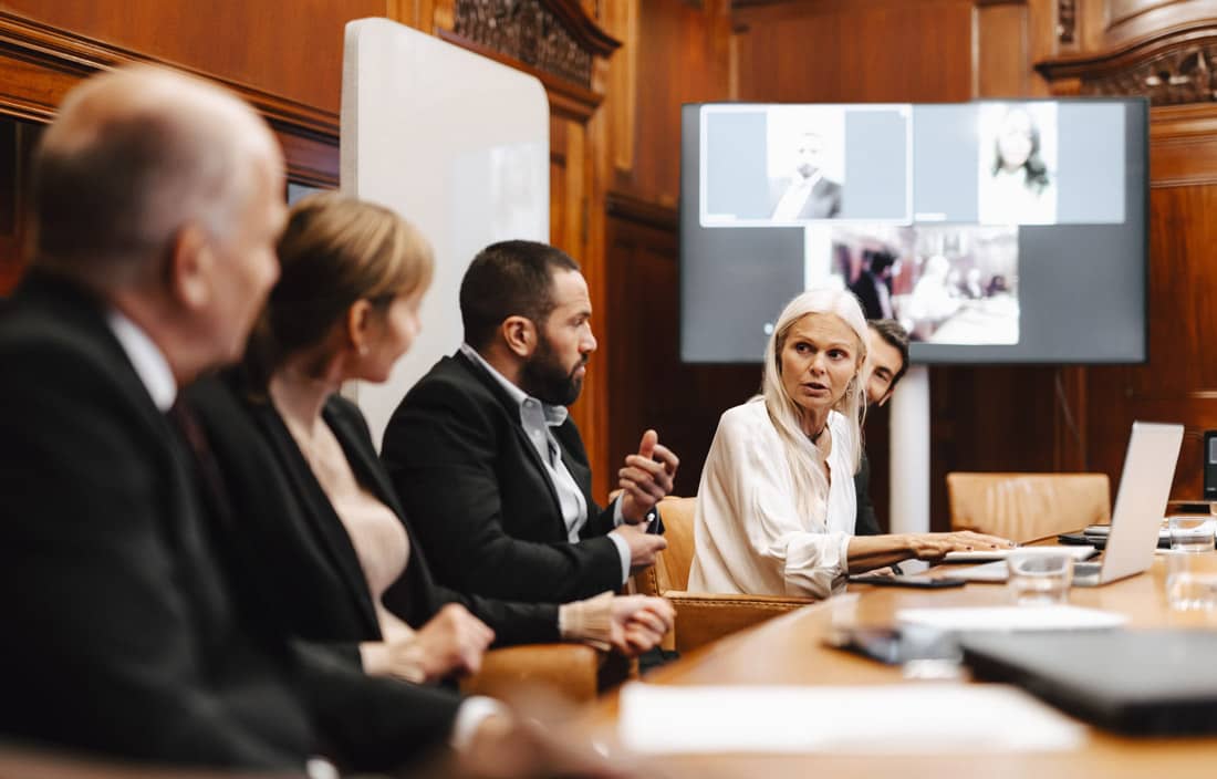 Business and law professionals in a boardroom.