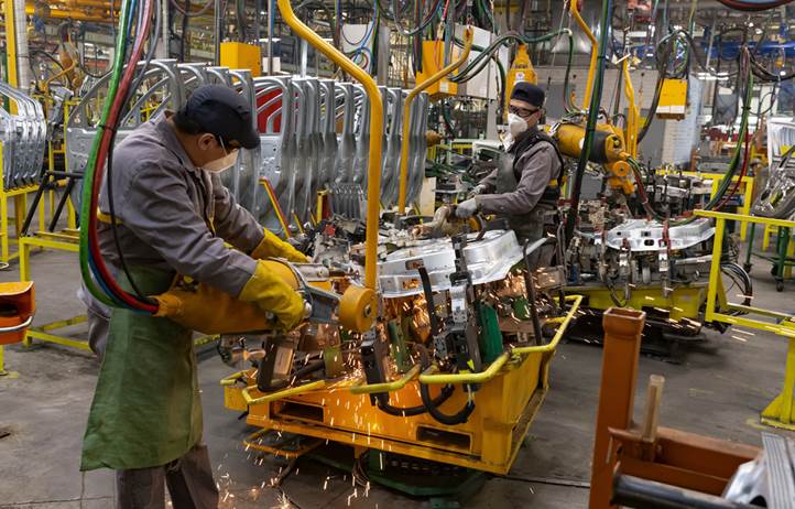 Manufacturer working on a factory floor.