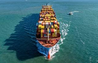 Aerial view of a freighter boat carrying cargo.