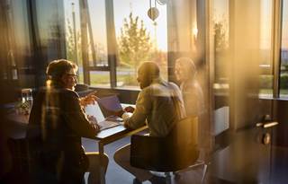 Business professionals in a modern conference room.