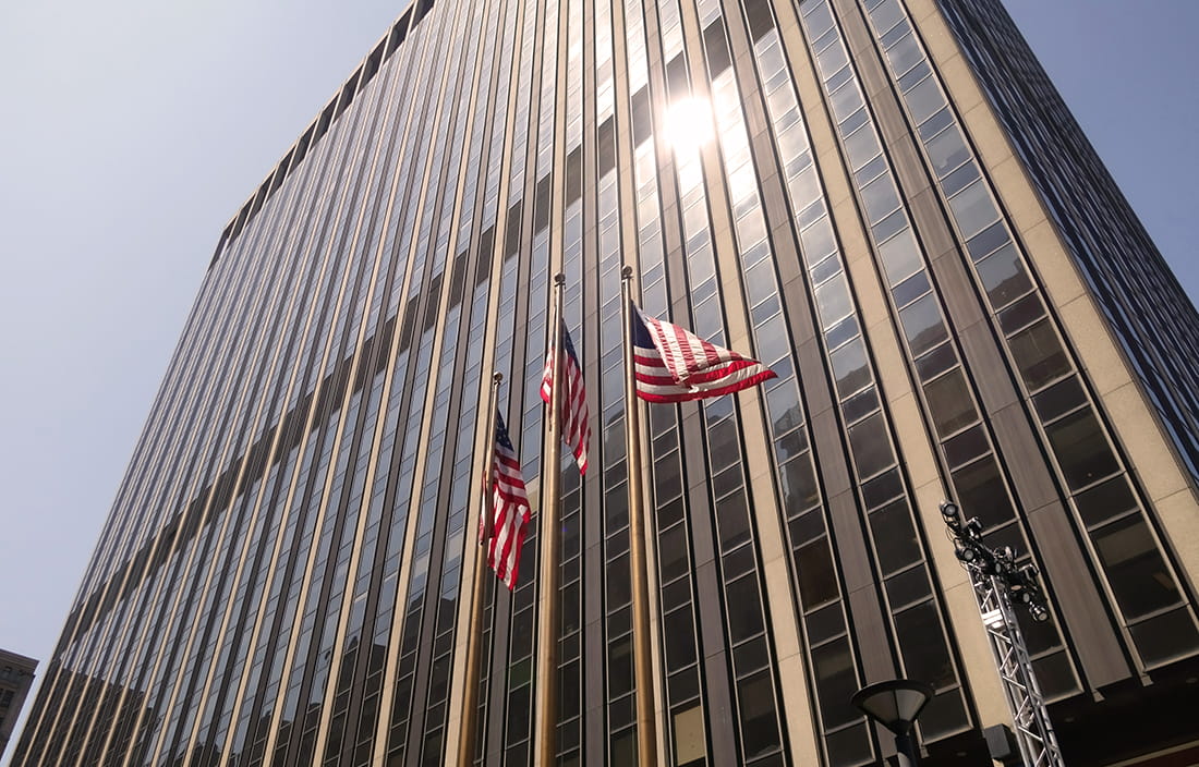 Building with American flags in front 