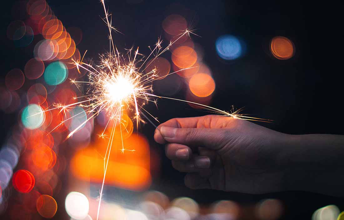 Hand holding a sparkler