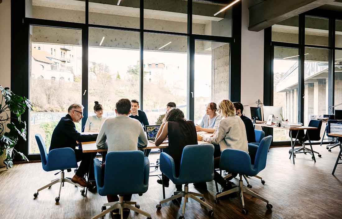 Business people in a modern day conference room having a meeting.