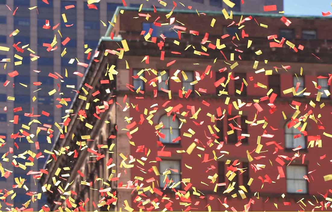 Close up of celebratory confetti falling from the sky.
