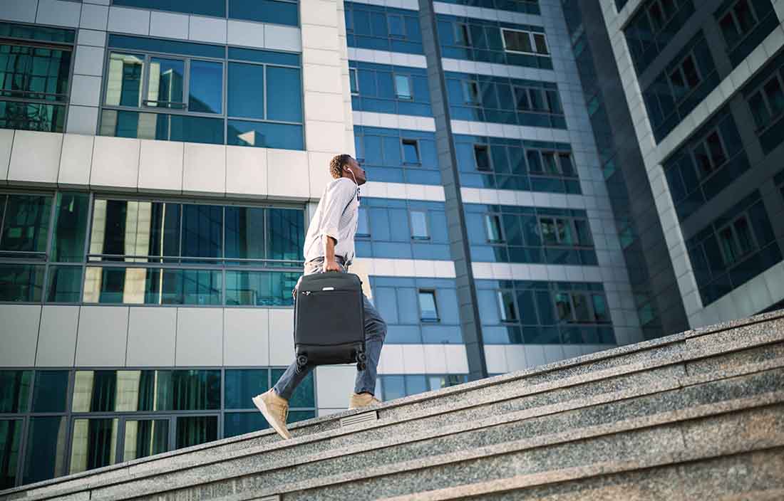 IT professional walking up stairs.