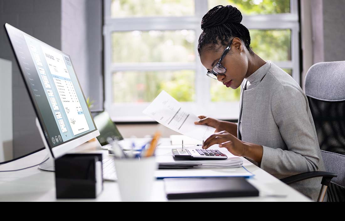 Government accountant at their desk working.