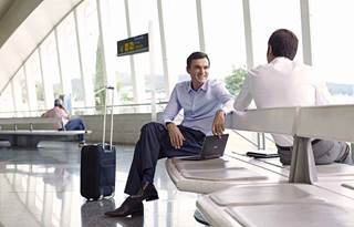 Millennials chatting in an airport together.
