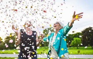 Two people celebrating with confetti.