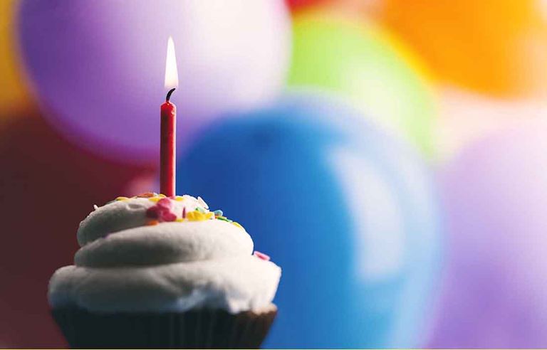 Cupcake and colorful balloons.