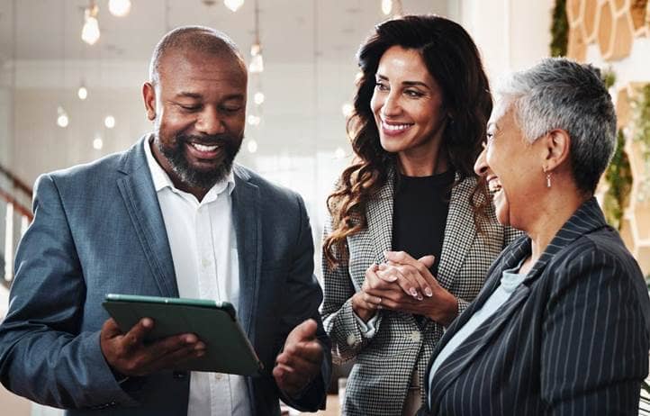 Group of business professionals talking to each other.