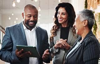 Group of business professionals talking to each other.