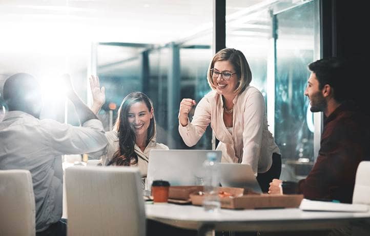 IT professionals celebrating.