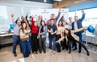 Plante Moran technology consulting team celebrating their recognition as Informatica's Partner of the Year.