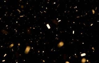 Confetti against a black background.