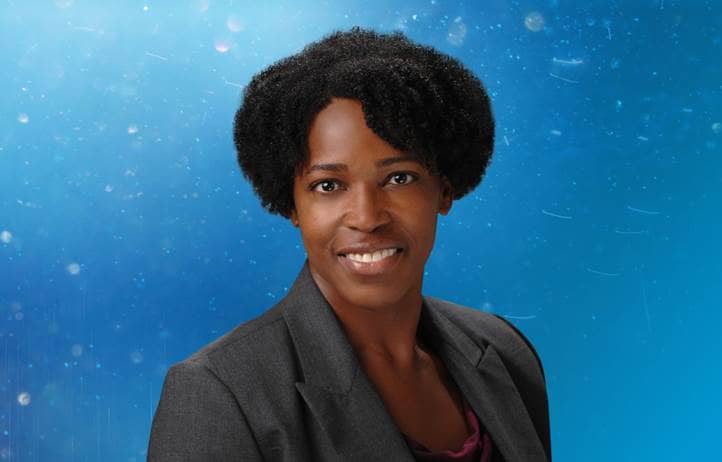 Professional photo of Felicia Donaldson in front of a blue gradient background.